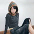 Model wearing Jacquard Knitted Balaclava in khaki, showcasing a cozy natural wool blend with artistic jacquard motifs.