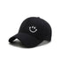 Front view of Joyful Grin Cap, displays iconic smile graphic embroidered on a durable and skin-friendly frame.