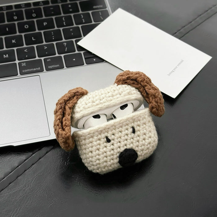 Front view of  beige Knitted puppy AirPods case cover with brown ears and black nose.