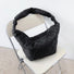 Folded view of Large Quilted Slouchy Bag in black, easy for commuting and weekends.