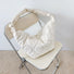 Flat lay of Large Quilted Slouchy Bag in white, great for everyday carry and travel.