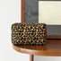 Folded view of Leopard Allure Makeup Bag in golden, great for on-the-go touch-ups.