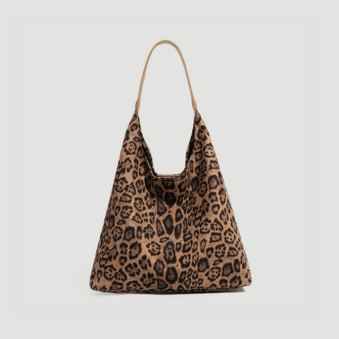 Front view of the bold leopard print suede hobo bag with a spacious interior.