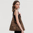 Leopard suede hobo bag styled with a neutral outfit for a modern animal print look.