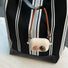 Close-up of Maillard Color Stone AirPods Case Cover hanging on a bag, ideal for gifting and everyday use.