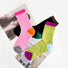 Three pairs of colorful mesh gauze socks: pink with orange heel, black with green heel, and lime green with blue heel.