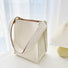 Cream polyester woven tote bag with vertical texture, milk carton design, and brown striped lining.