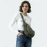 Model wearing the olive green version of the duvet crescent bag as crossbody.