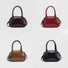 Front view of Four mini PU leather bowling bags in brown, red, tan, and black, with grab handles and detachable.
