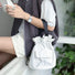 Off-white mini nylon bucket bag for a clean and minimalist utility style.