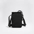 Studio view of the tactical matte black multi-way water bottle sling pouch with adjustable crossbody straps.