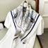 Close-up of a satin scarf Nautical Chart Satin Square Scarf draped on a shirt, easy for weekend styling and gifting.