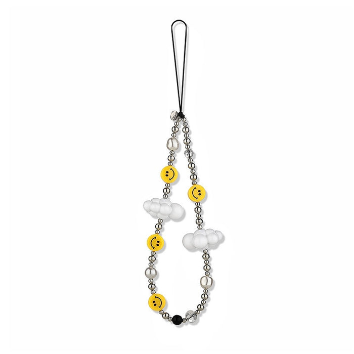 Alloy phone charm with yellow smiley faces, white cloud beads, and clear/silver beads on a black cord.