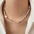 Model wearing an Ocean Breeze Necklace in Aqua Beads, great for everyday outfits.