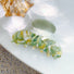 Close-up of geen Oil Painting hair claw , easy for workdays and special occasions.