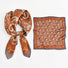 Rich brown and orange paisley scarf with vintage-inspired motifs adding sophisticated accent to fashion gatherings.