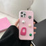 Pink leather case with abstract charms, cream and pink accents. Trendy Coquette aesthetic cover.