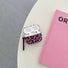 Angled view of Pink Leopard Print Airpods Case Cover, easy to carry for commutes and errands.