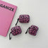Three different sizes of pink leopard print silicone AirPods cases with black carabiner clips.