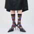 Model wearing a pair of Plaid Patchwork Socks, great for casual wear and light workouts.