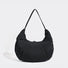Angled view of Pleated Crescent Shoulder Bag in black, great for everyday carry and travel.