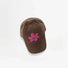 Brown corduroy baseball cap featuring a pink plush flower embroidery.