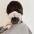 Model wearing Plush Scrunchie in beige, ideal for quick updos and ponytails.