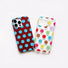 Two polka dot silicone phone cases in brown/blue dot  and multi-color dots side by side.