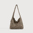 Primal Leopard canvas slouchy bag with adjustable strap and outer slip pocket.