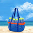 Angled view of Blue polyester mesh beach bag with lime green top trim, orange pockets, shoulder straps, and snap.
