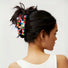 Model wearing Rainbow plaid acrylic claw, easy for workdays and special occasions.