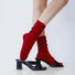 Model wearing a pair of red slouch socks, easy for travel days and daily comfort.