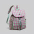 Three-quarter studio display of the pink and green colorblock plaid backpack showing padded construction.