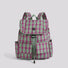 Studio flat lay of the pink and green retro colorblock plaid nylon backpack with front pocket details.