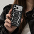 Model holding the retro lace iPhone case wearing a black outfit for a coquette aesthetic mirror selfie.