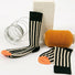 Angled view of Retro stripe orange socks with black and cream vertical stripes and orange toe.