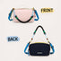 Front pink side and reversed navy blue back side display of the reversible nylon crossbody pouch.