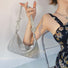 Model carrying a Rhinestone Hobo Bag in hand , ideal for city walks and gifting.