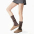Model wearing a pair of brown  Ribbed Knit Leg Warmers, great for casual wear and light workouts.