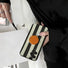 Handheld stripe phone case with grip; stylish accessory perfect for mirror selfies and social media content.