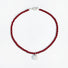 Flat lay of red rose dew necklace showing artificial pearl drop and toggle clasp