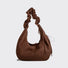 Front view of Brown vegan suede hobo bag with a slouchy crescent shape and adjustable ruched strap.