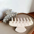Angled view of Shell Hair Claw hair claw clip in ivory hair accessory and camel hair accessory, ideal for quick updos.