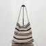 Flat lay of Simple Striped Knitted Bag in oat, great for everyday carry and travel.