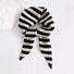 Angled view of Simple Striped Triangle Scarf in gray and black, great for office layering and commuting.