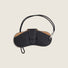Front view of Black PU leather lychee glasses case with white stitching and a strap.