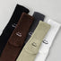 Front view of Five pairs of cotton-blend slouch socks in black, brown, charcoal, olive, and white.
