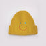 Front view of Smiley Ribbed Knit Beanie in yellow. Bright energetic hue in a breathable, soft-knit texture.