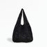 Angled view of Square Pattern Crochet Bag in black, great for everyday carry and travel.
