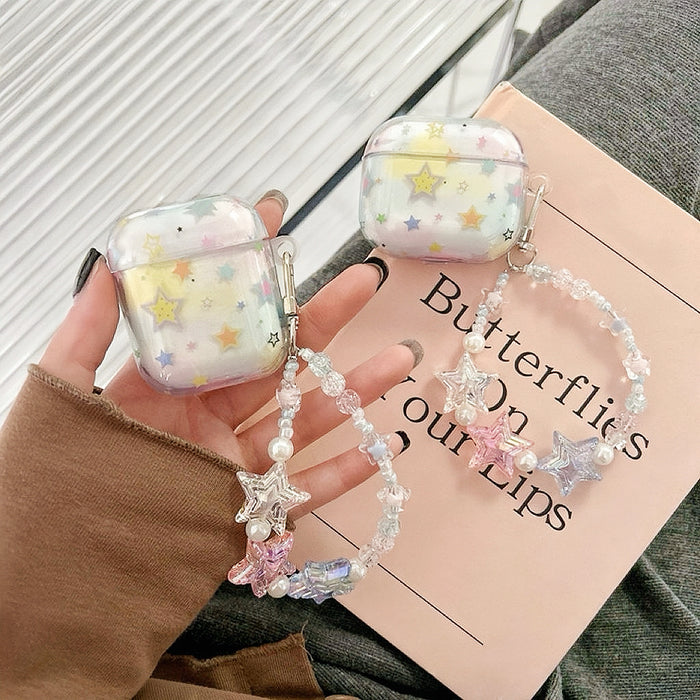 Model holding a Starry Dream Airpods Case Cover, with pastel starry design and beaded strap.